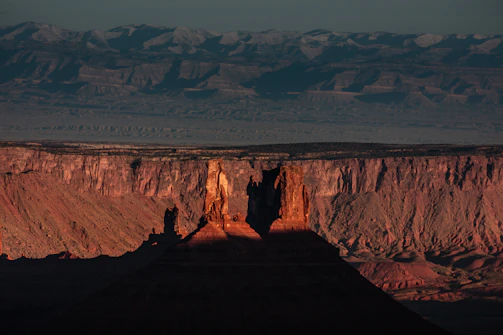 Sunset over St George landscape with red rock formations symbolizing local roots.