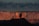 A vibrant painting of Utah's redrock landscape at sunset.