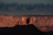 A vibrant painting of Utah's redrock landscape at sunset.