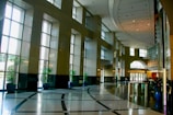 Clean office lobby with bright natural lighting and plants.