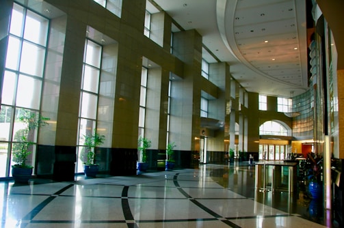Clean office lobby with bright natural lighting and plants.