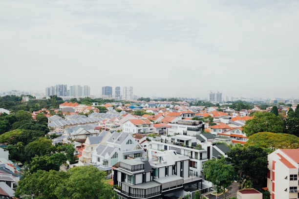 A welcoming Orange County neighborhood with modern homes under a clear blue sky.