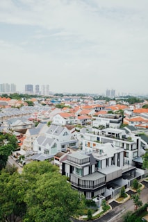 Wide shot of a Great Neck neighborhood showing several homes with new roofing.