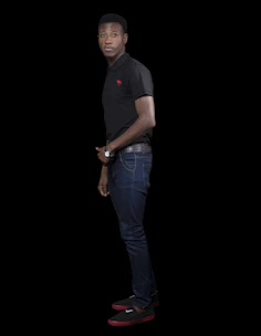 Model wearing a crisp vantoro polo shirt standing against a minimalist urban backdrop