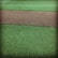 A textured surface featuring a path-like strip of coarse brown gravel running horizontally through two areas of vibrant green artificial grass.