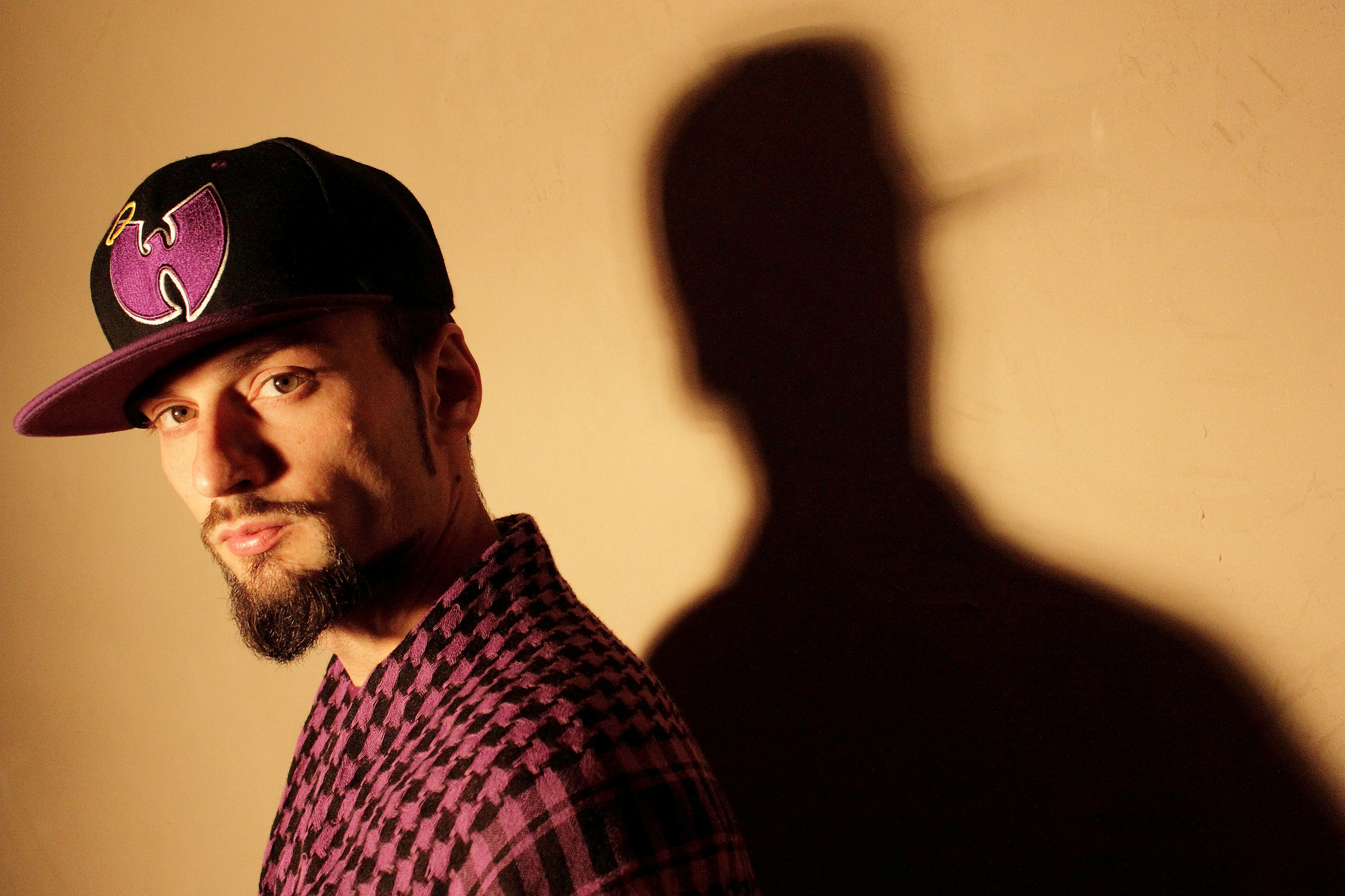 man in black cap (Photo by Julian Scagliola on Unsplash)