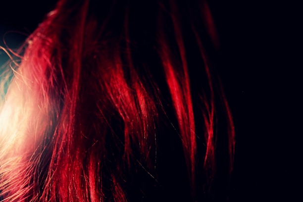 Close-up of vibrant hair color reflecting the natural light in the Helsinki salon.