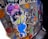 A colorful graffiti sticker depicts a cartoon-style character wearing oversized sunglasses, a purple hat, a yellow shirt, and blue overalls. The background features a mix of vivid colors and abstract shapes, including polka dots, with the word 'TRENDSETTER' partially visible.
