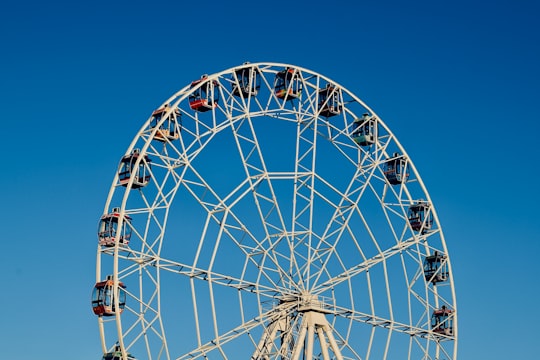 white and maroon Ferris wheel in Cheboksary Russia