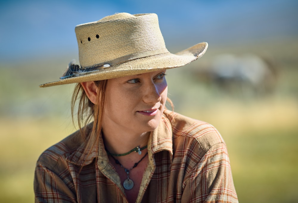 woman in beige hat