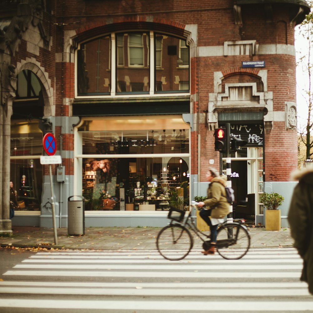 woman riding bike on pedestrian lane