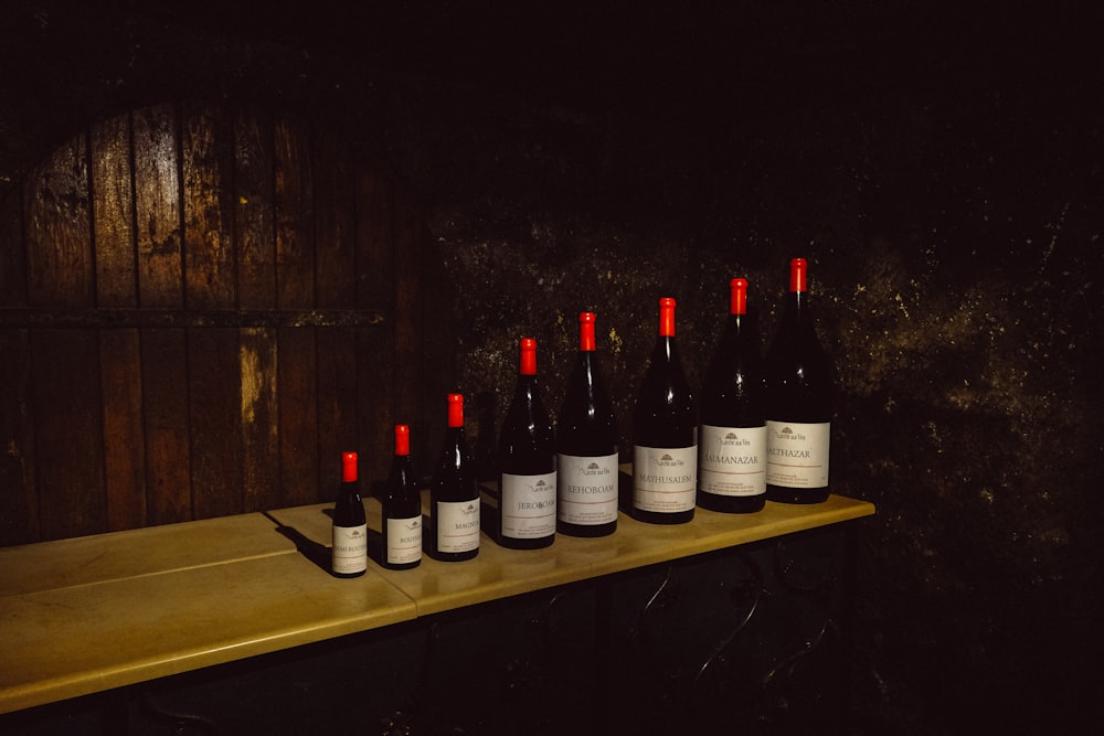 assorted wine bottles on table