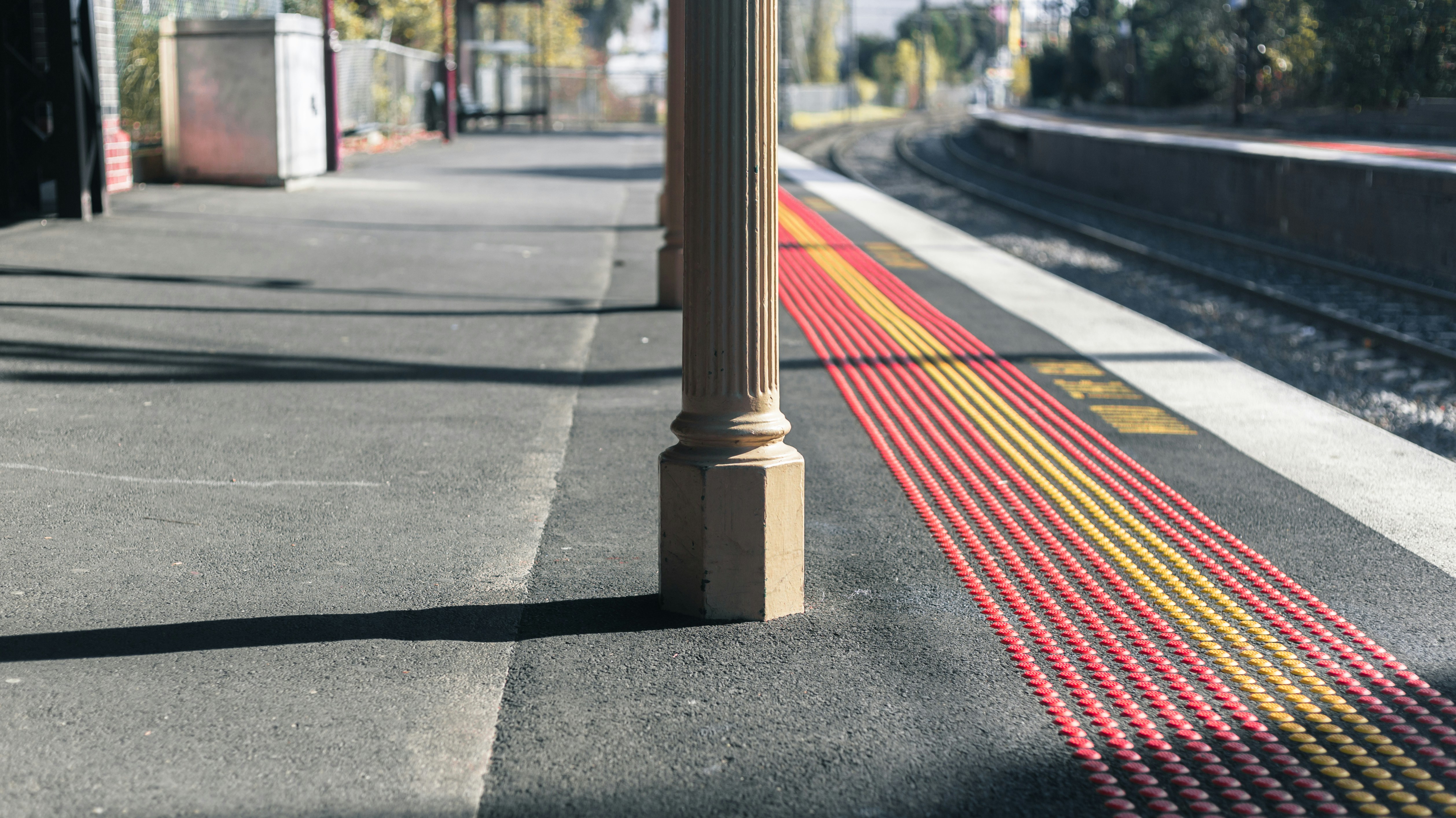 Station platform edge with yellow tactile strip