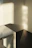 Cozy morning light spilling over a sleek minimalist dressing table in a bright room.