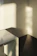 Cozy morning light spilling over a sleek minimalist dressing table in a bright room.