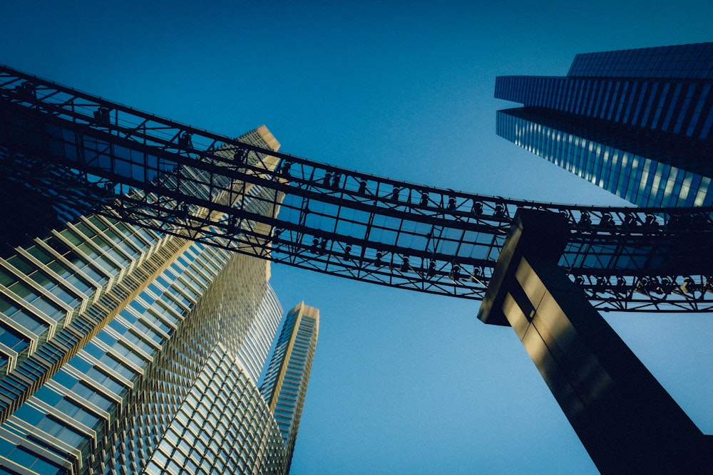 low angle photography of bridge and buildings