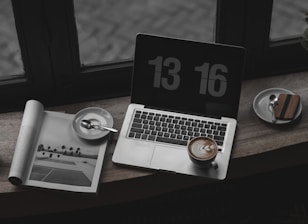 A tennis analyst reviewing match statistics on a laptop.