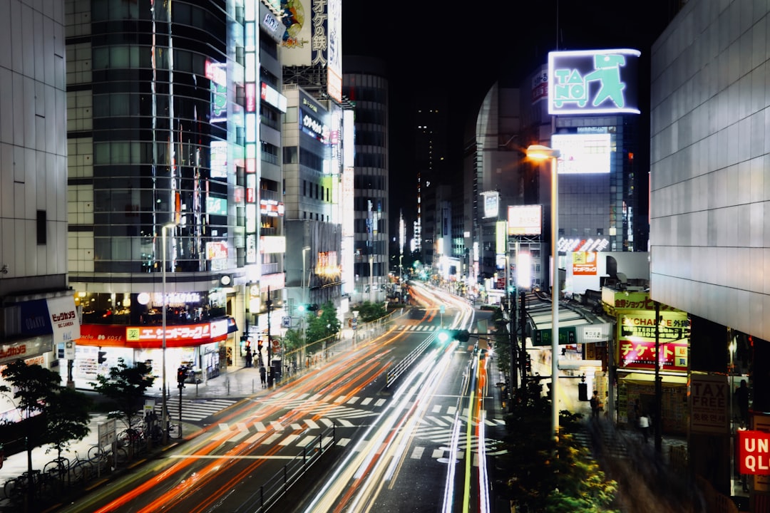 time-lapse photography of cars on road at night