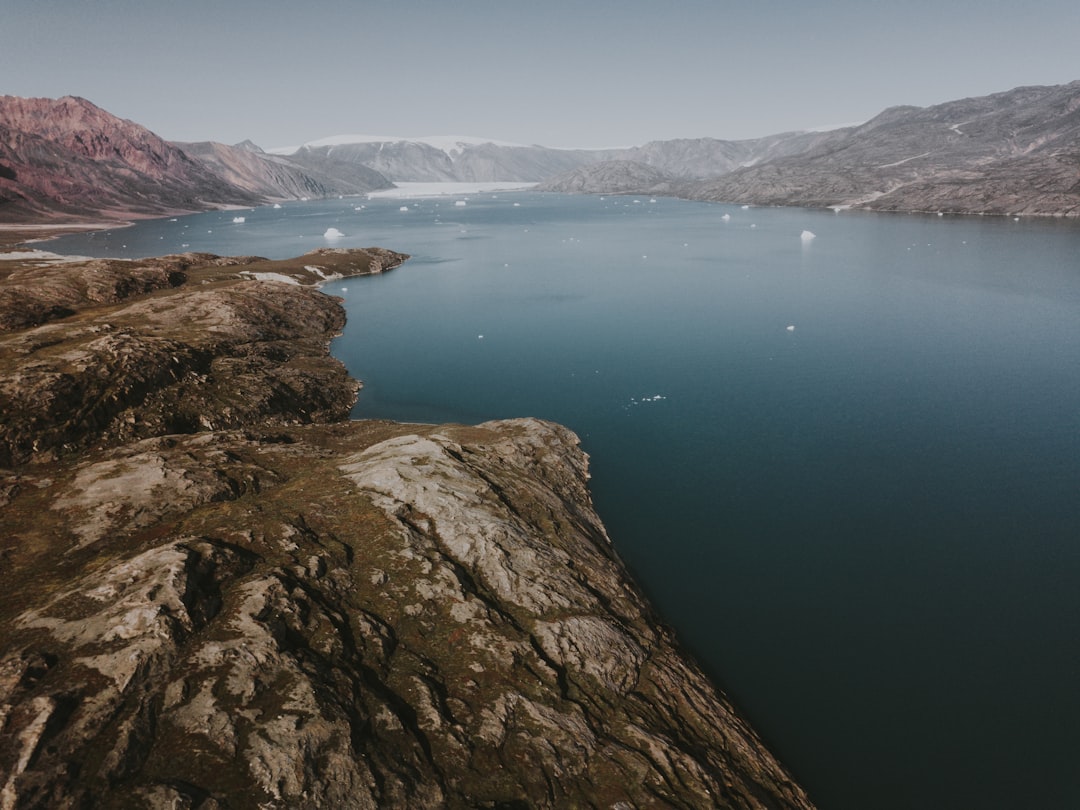 calm body of water between rock formations