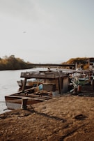 A rustic wooden boat moored by the river, reflecting the maritime heritage of the region.
