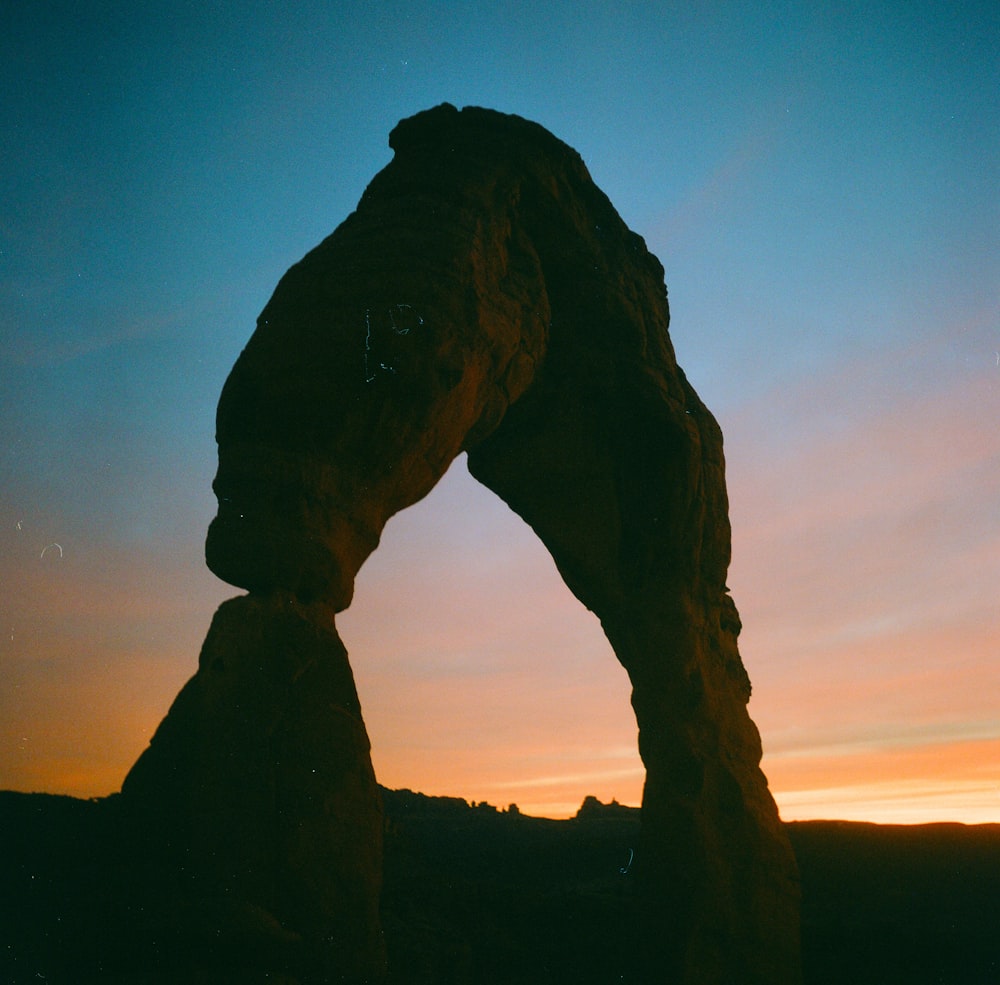 brown rock formation during sunset