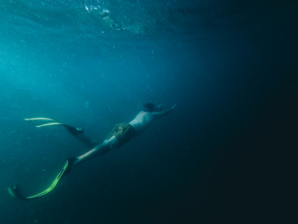 person swimming underwater