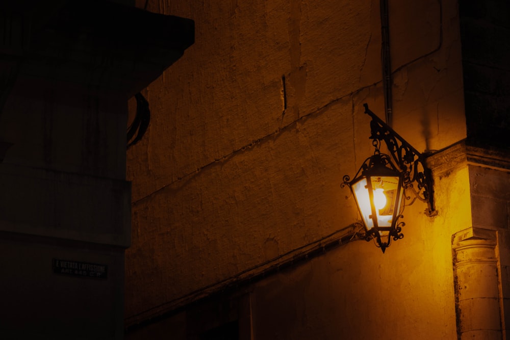 black sconce light turned-on during nighttime