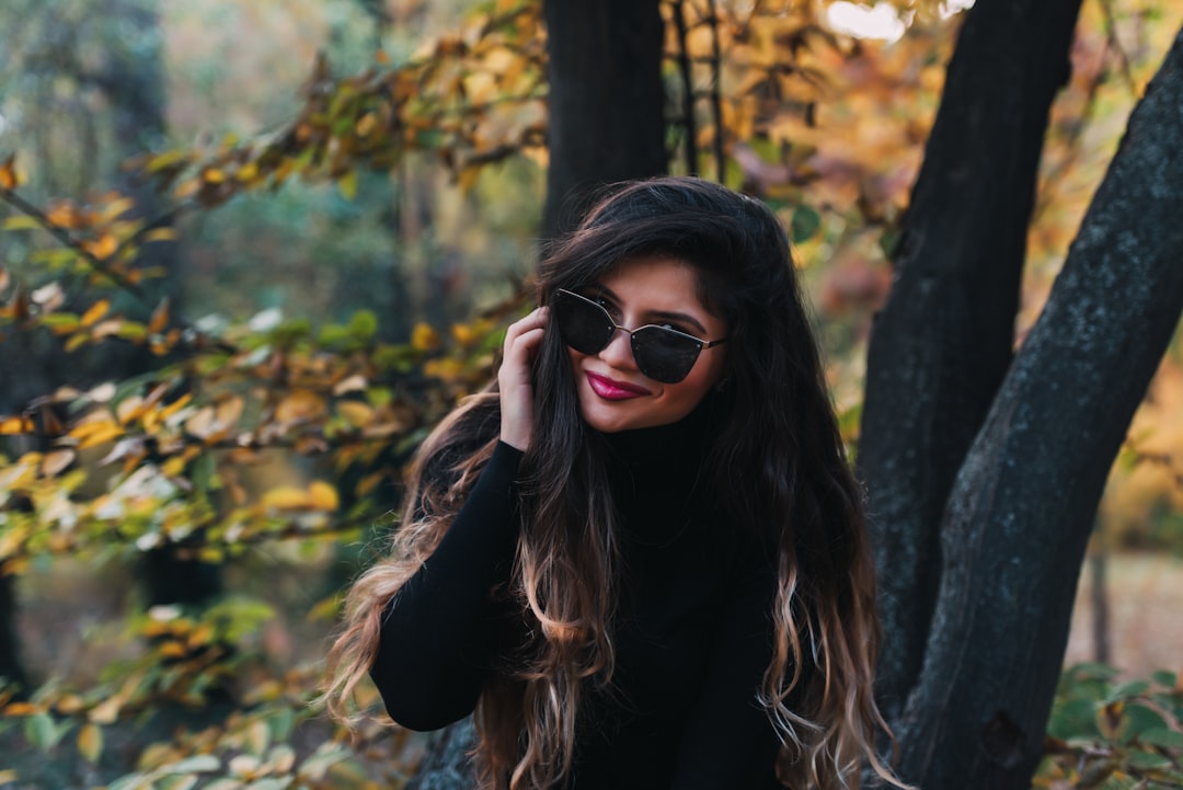 smiling woman wearing sunglasses