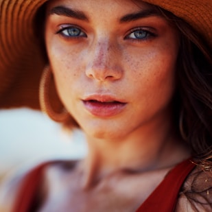 woman wearing sun hat and sleeveless top