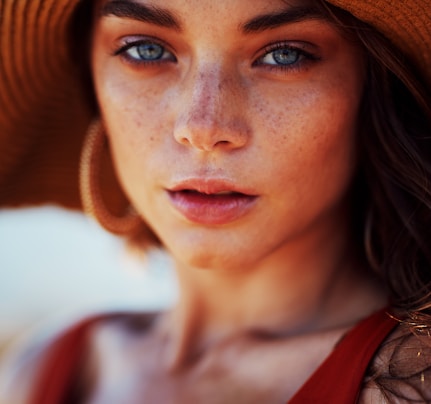 woman wearing sun hat and sleeveless top