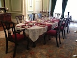 An elegant dining set made of premium wood in a bright space.