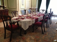 An elegant dining table set with matching chairs.