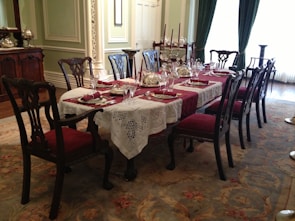 An elegant dining set made of premium wood in a bright space.