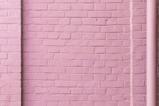 external home brick wall painted pink