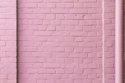 external home brick wall painted pink