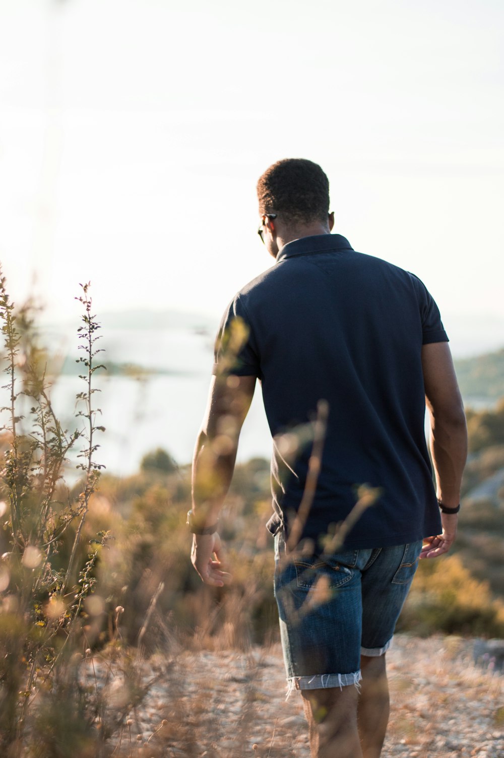 man walking in shallow photo