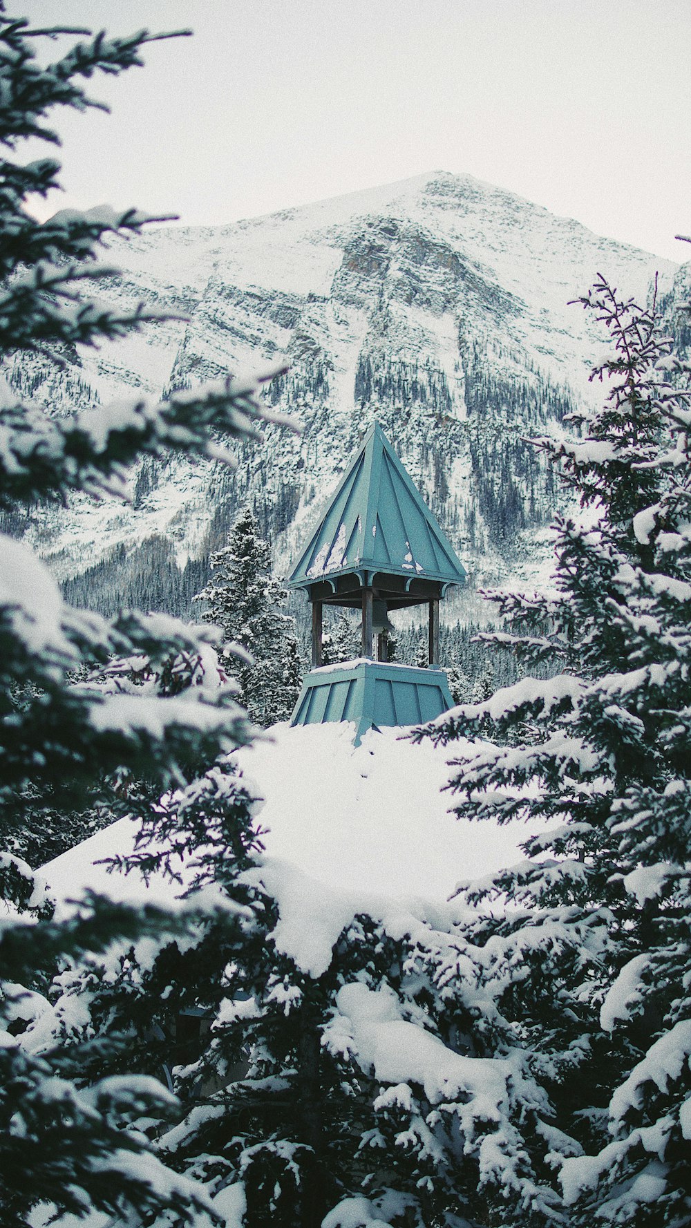 teal building on top of hill