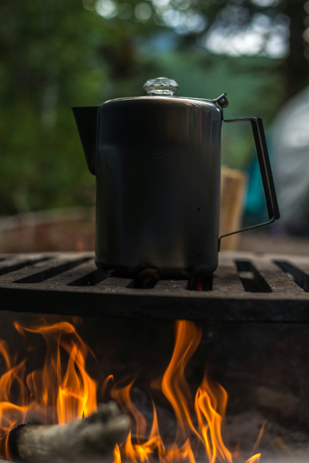 black kettle above fire burning