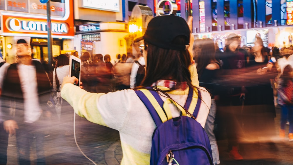 woman taking selfie photo near road