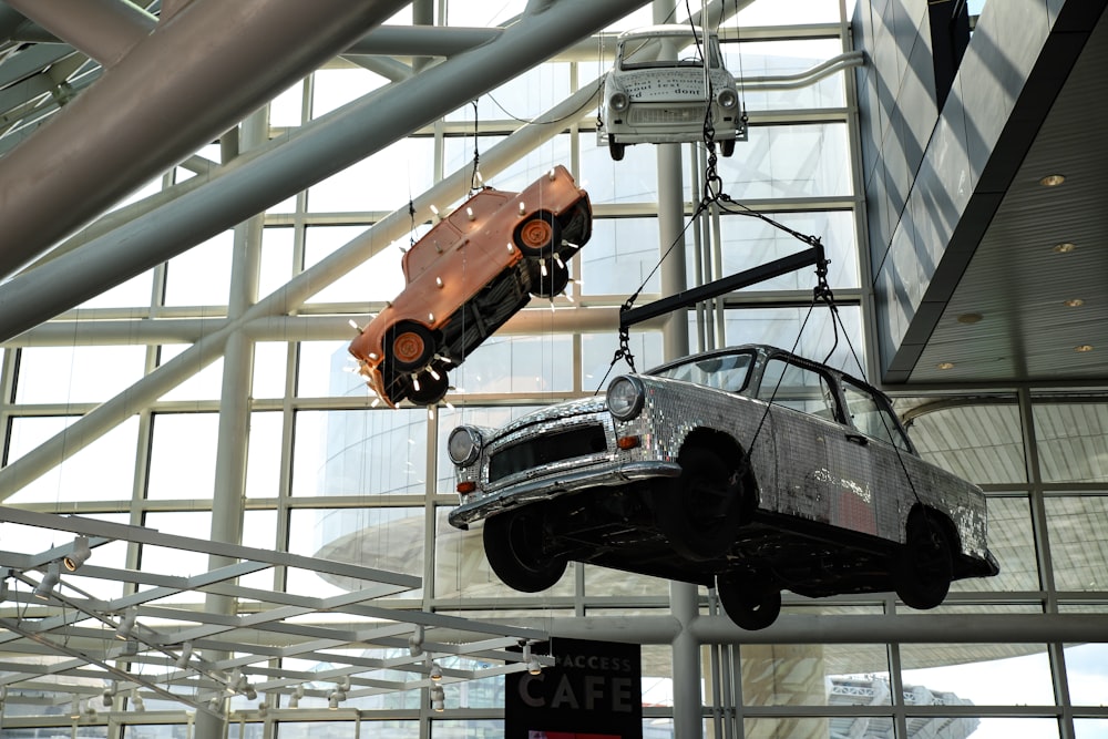 three cars hanged inside building