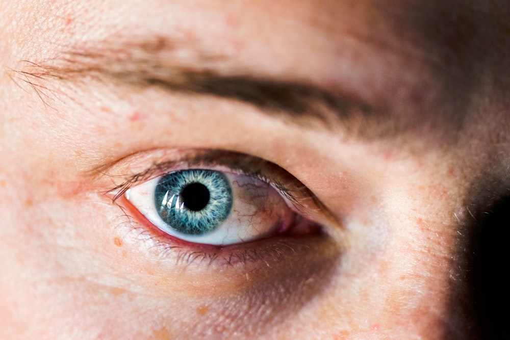 selective focus photography of person eye