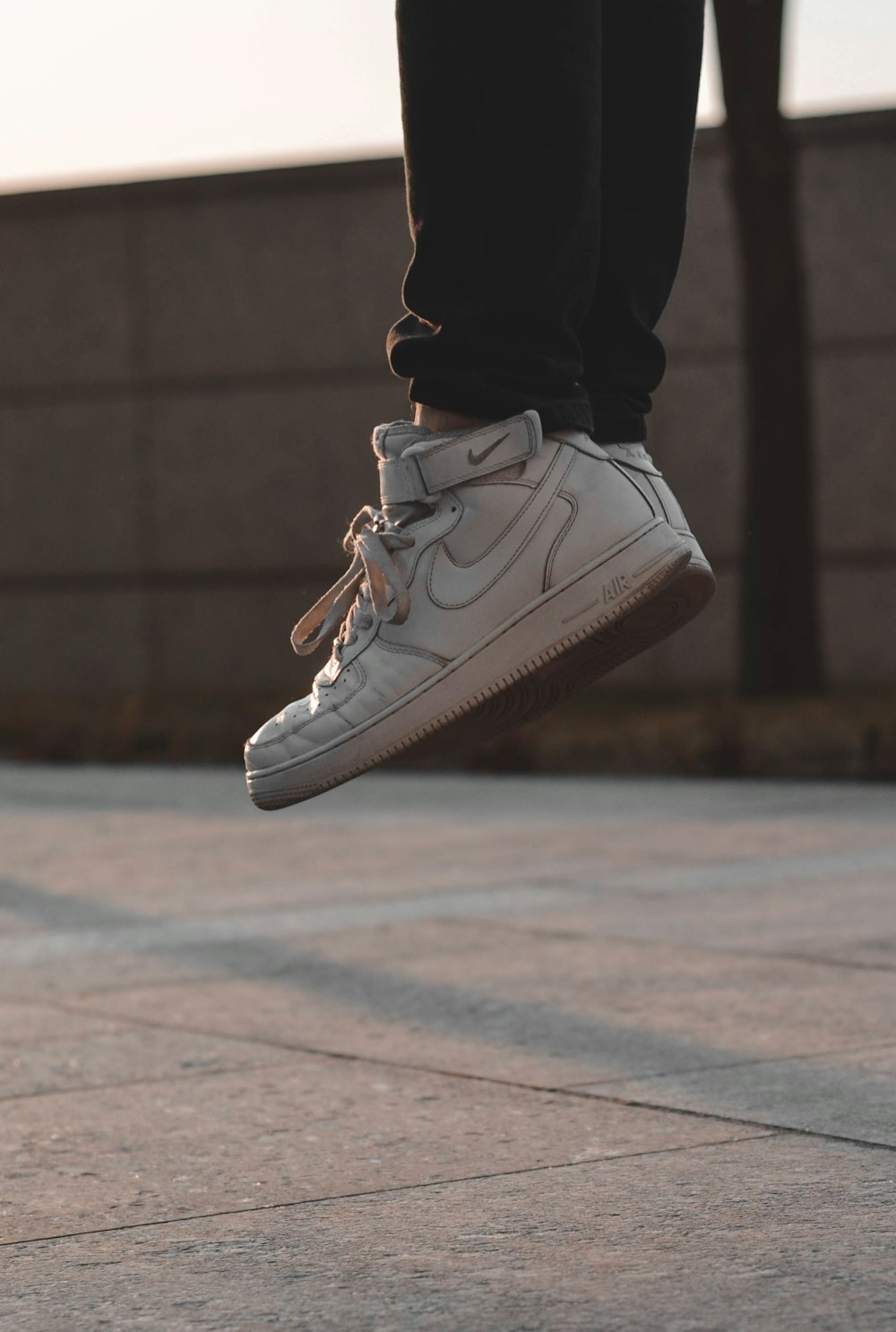 person wearing white Nike high-top shoes photo – Free Grey Image on Unsplash