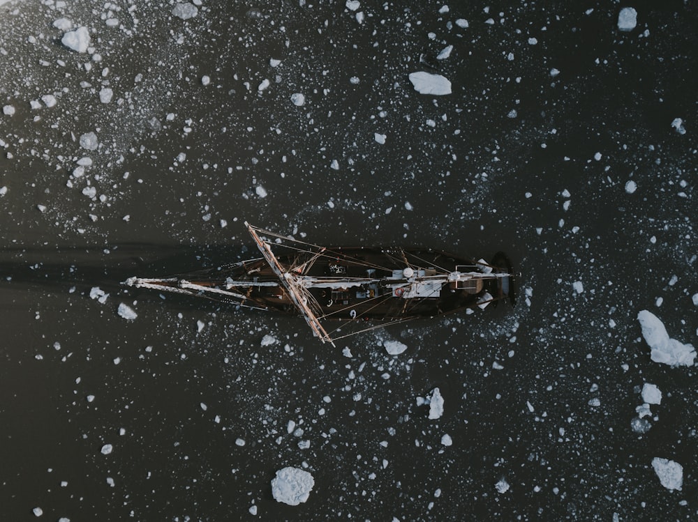 boat on body of water with icebergs