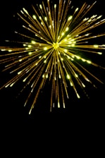 Bright red and yellow explosion graphic with musical notes bursting out.