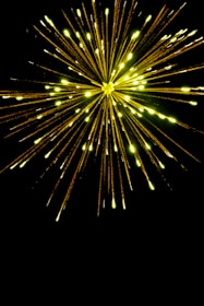 Bright red and yellow explosion graphic with musical notes bursting out.