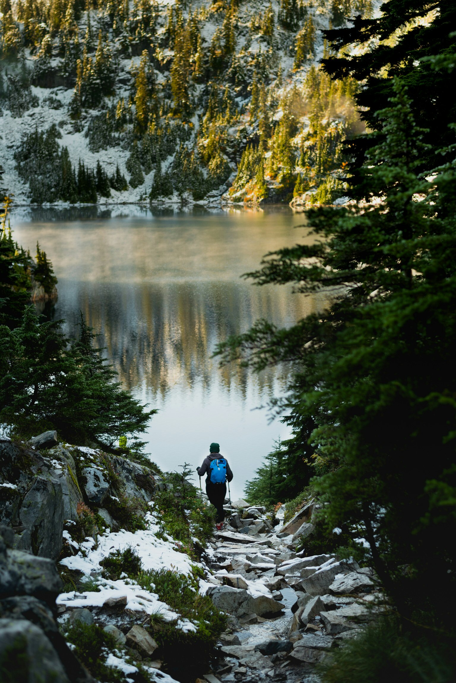 man standing near body of water