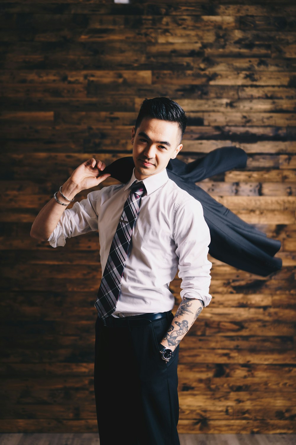 smiling man wearing suit standing