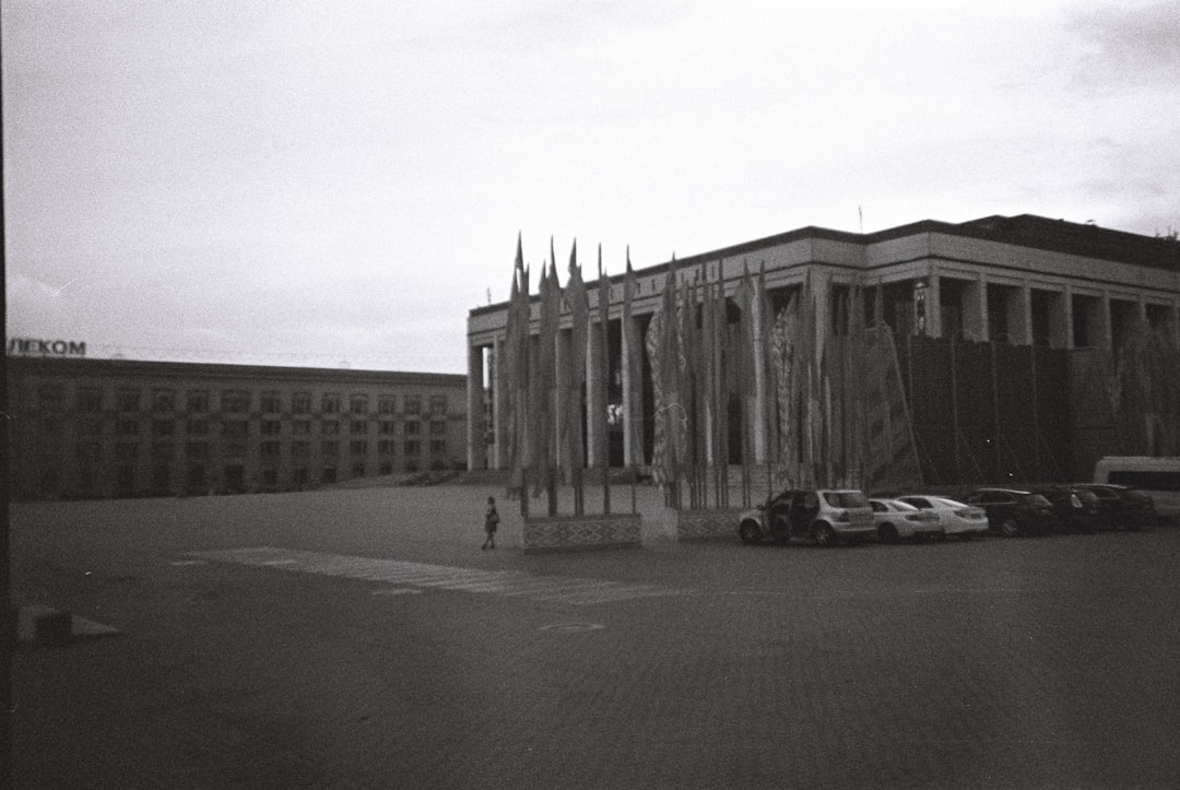 grayscale photo of white and black concrete building