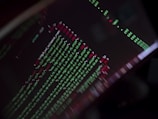 A close-up of code on a screen with game graphics.