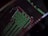 A close-up view of a computer screen displaying programming code with lines of text in green, red, and white against a black background. The code appears to be slightly blurred, creating a moody and abstract visual effect.